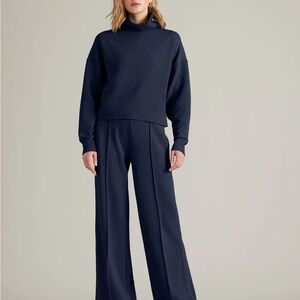 Rhone DreamGlow Trouser and Mock Neck. NWT. Size M. Navy Blue